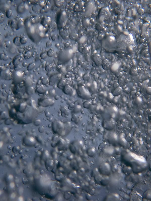 water bubbles rising up in the ocean