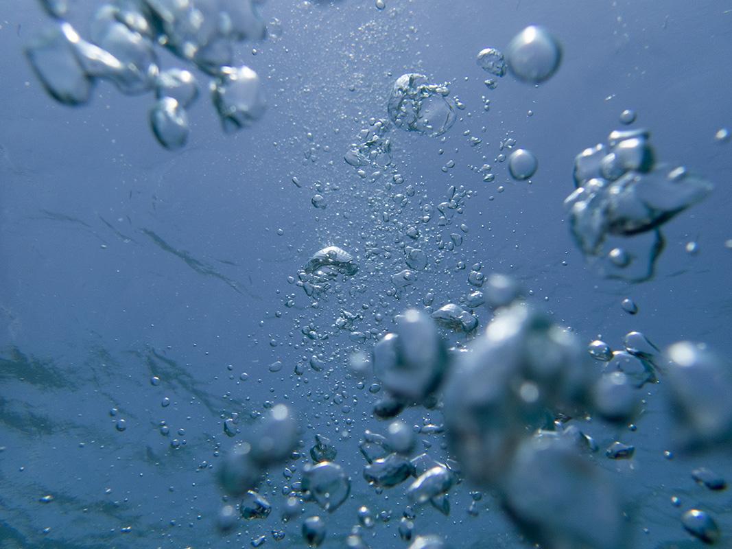 blue grey open water bubbles captured on film